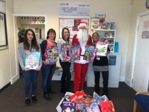Staff receiving donated Advent Calenders. 